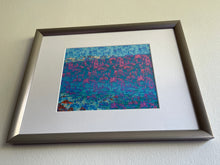 Load image into Gallery viewer, We Are One is an abstract landscape artwork featuring the ocean and trees in blues and some pinks placed with a frame.