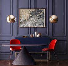 Load image into Gallery viewer, Abstract art photography with levels of brown, black, and white colors in a sophisticated room with a purple table, red chairs, purple luxury wall, and hanging golden light.