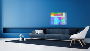 The abstract art with vibrant colors offers invitations & insights for guidance with goals of transformation in a room with a large sofa and chair.