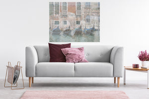 This Venice Italy art piece shows the architecture, history, and fascination in a lovely room with a sofa.